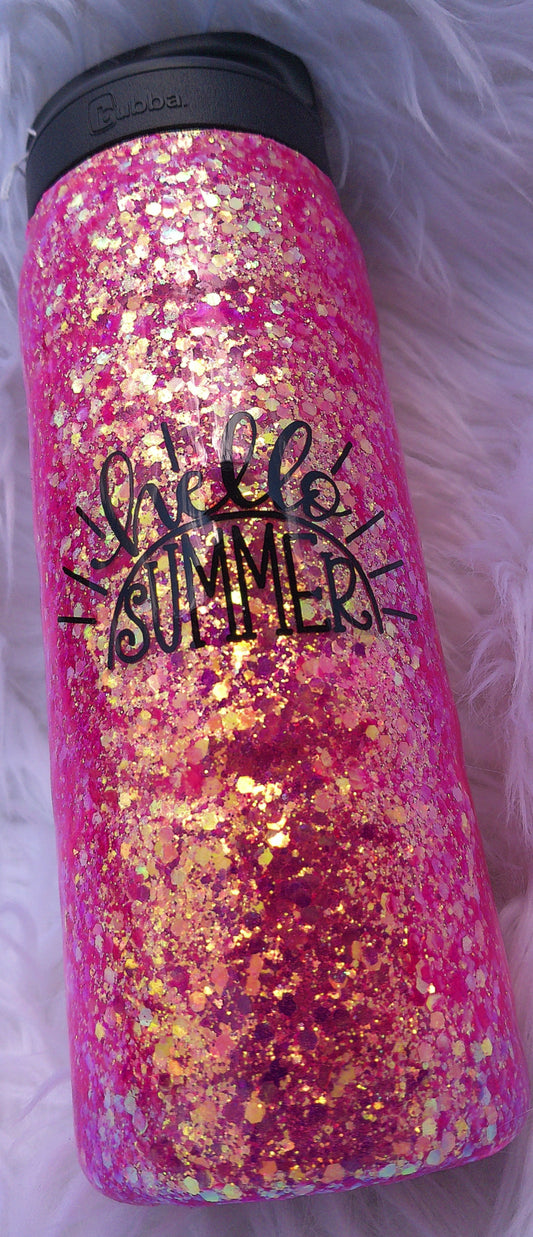 Pink glittery tumbler with black text on a white background
